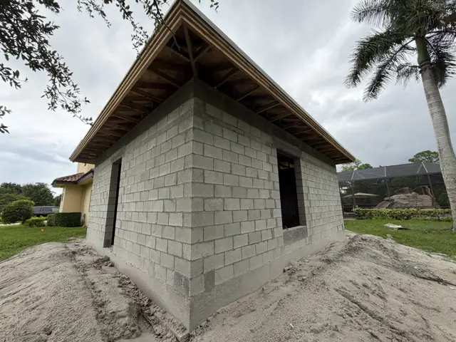 88th Road N project in Palm Beach Gardens, FL — Plans and permits, slab and footings, CMU walls and tie beam for an in-law suite addition.