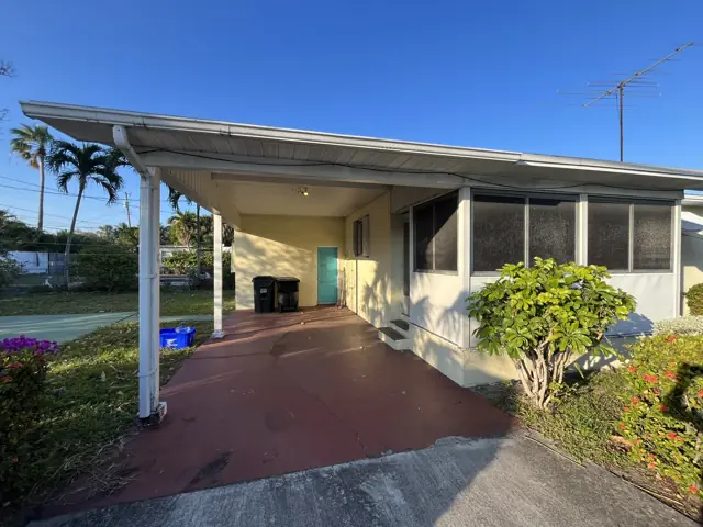 N Palmway project in Lake Worth Beach, FL — Slab cutting, raised floor framing, a new CMU opening with concrete lintel, and load-bearing wall removal for an investor renovation.